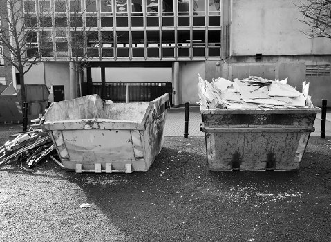 Residential area in Hackney with a skip placed on the street